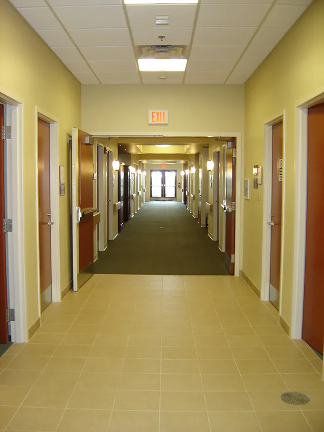 Corridor of the patient room wing at Hospice Care Plus in Richmond, Kentucky